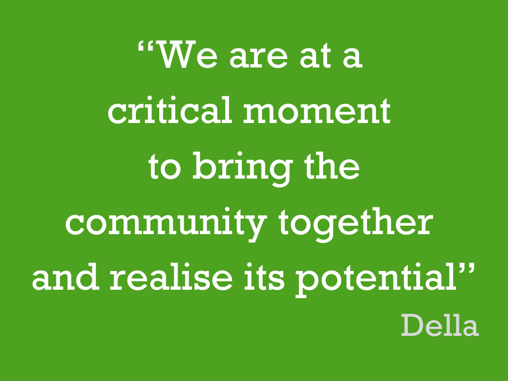 White text on a green background, reading: “We are at a critical moment to bring the community together and realise its potential”. Della